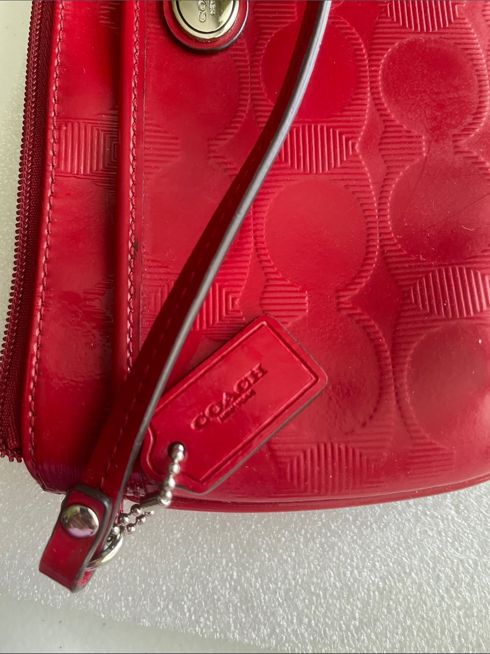 Coach eye catching Red Signature Embossed Wristlet